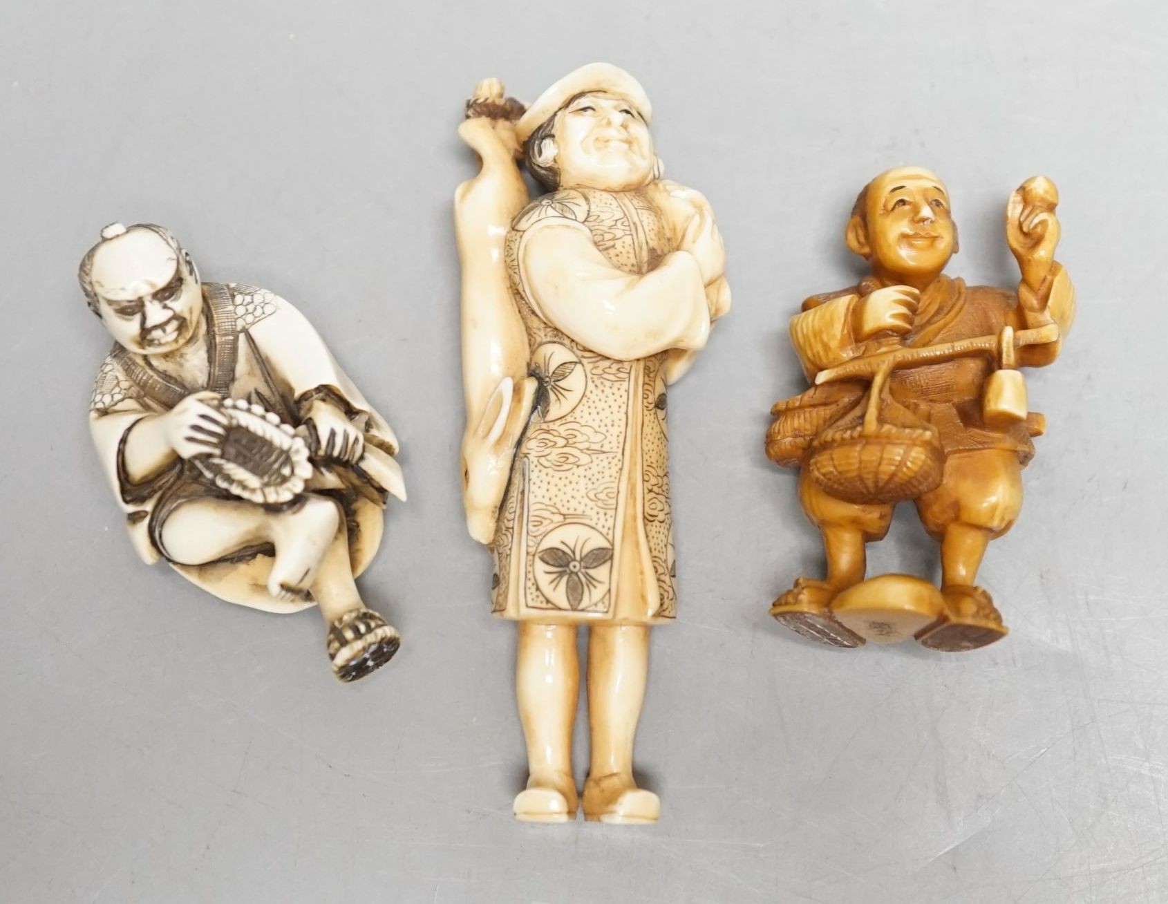 Three Japanese ivory netsuke of men, Taisho/early Showa period, signed - tallest 8cm